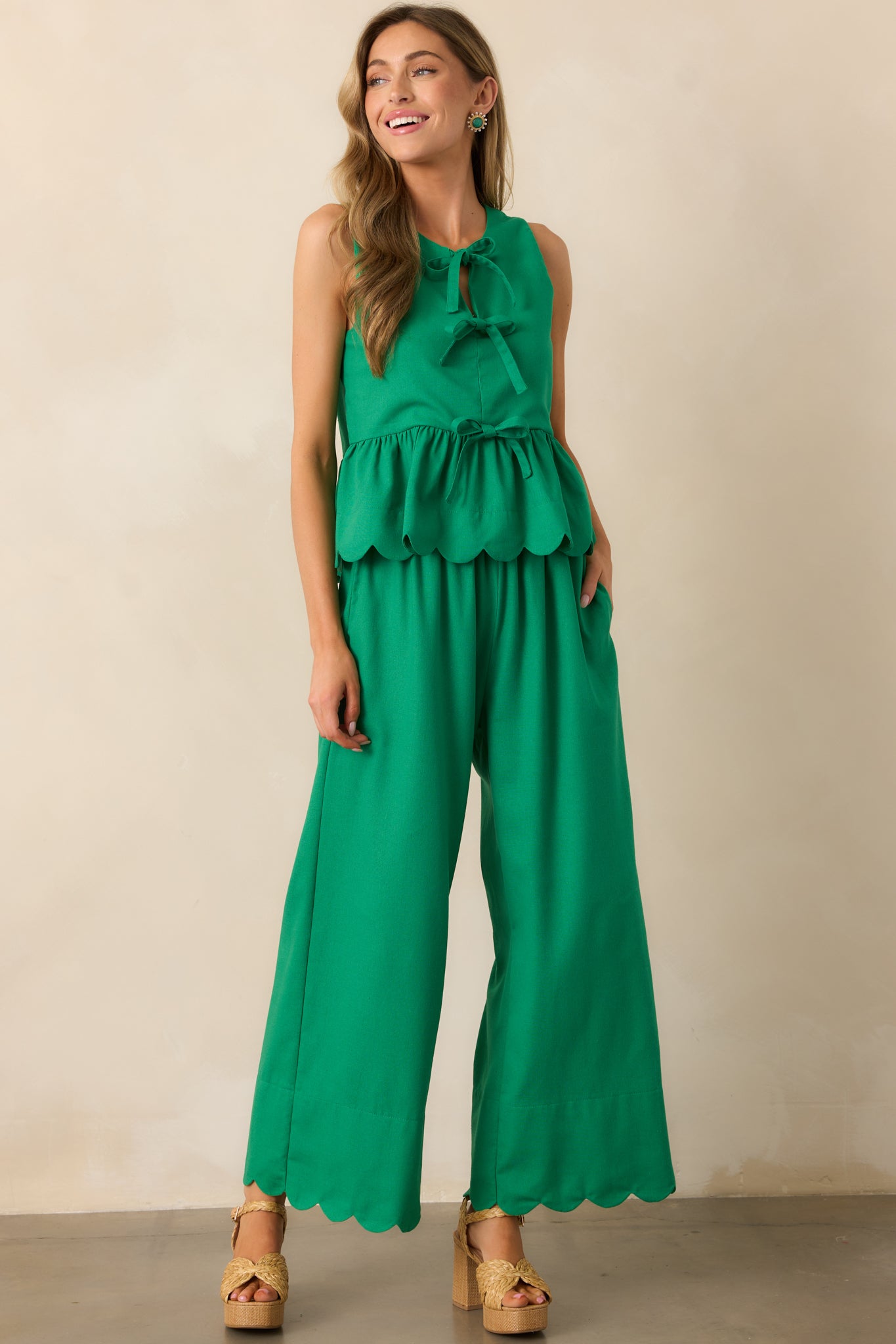 Green pants with a high waist and wide-leg design, creating a flowy and effortless look.