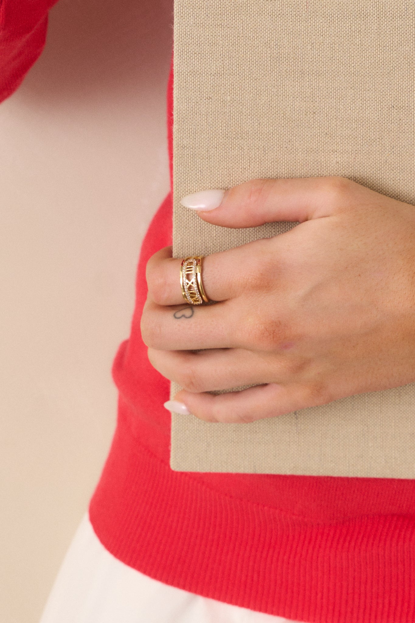 A side-angle shot of the ring, emphasizing the thickness of the gold band and the intricate design.