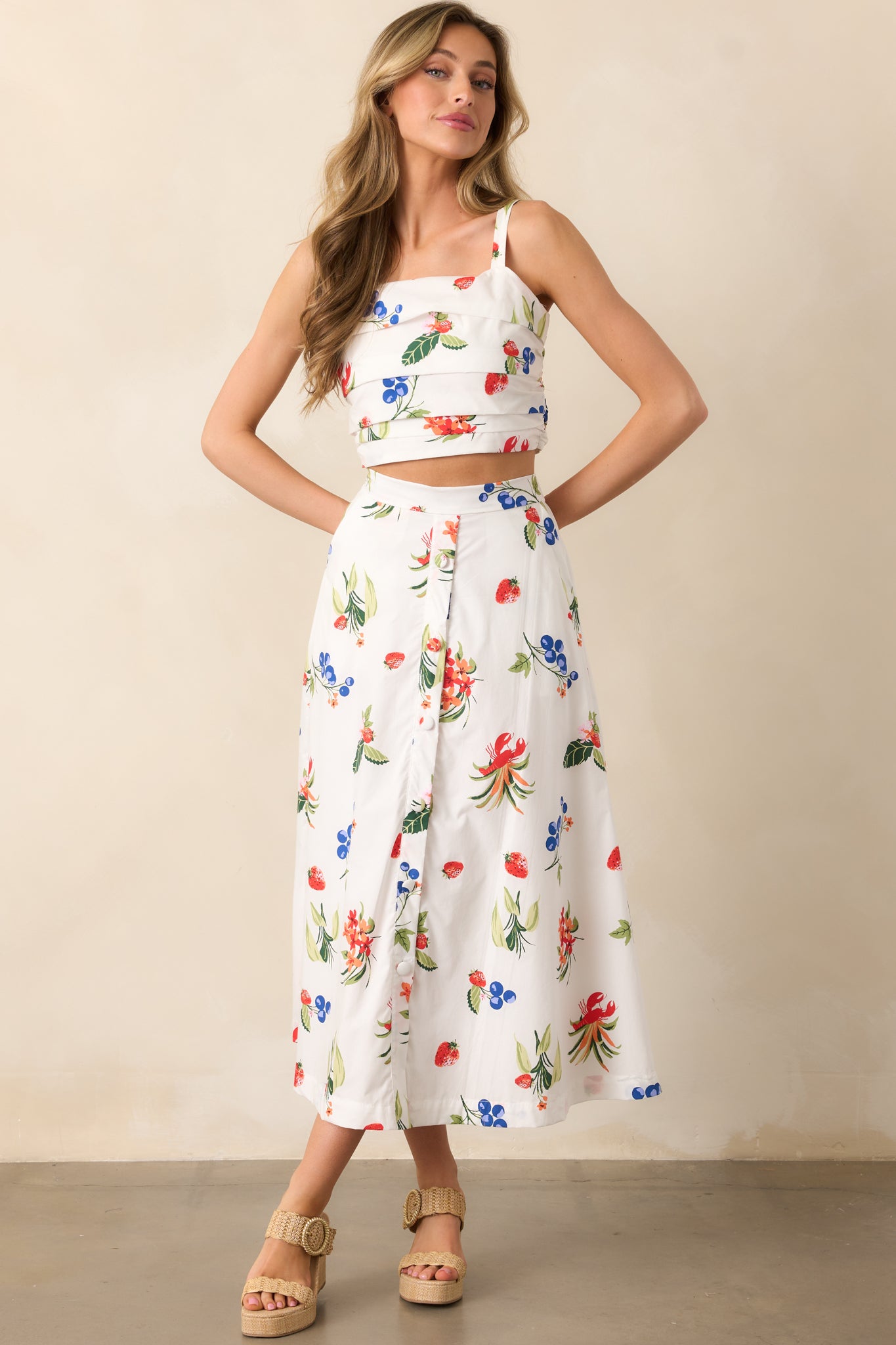 A chic pleated top with adjustable straps and a square neckline, offering both comfort and style with a self-tie bow at the back.