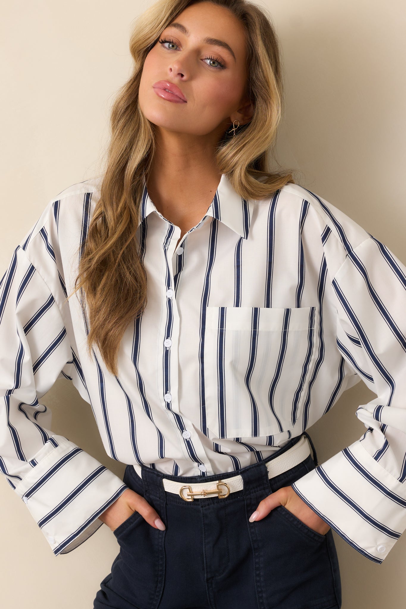 A close-up of the top’s collared neckline and upper buttons, showcasing the clean lines and vertical stripe detail.